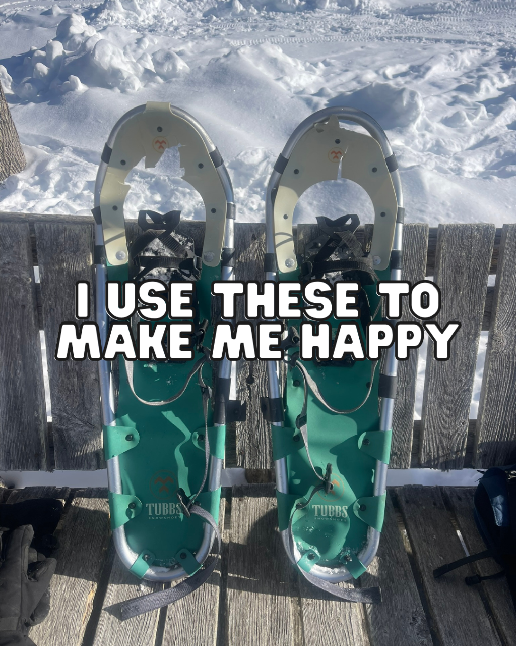 Pair of snowshoes resting on a wooden deck surrounded by snow, used for daily winter walks to regulate the nervous system and support porn addiction recovery.